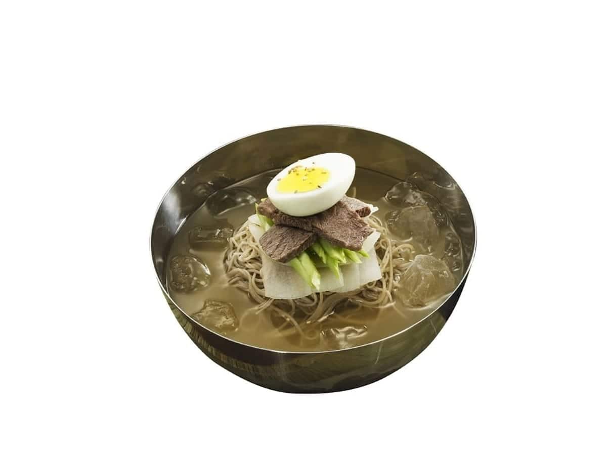 Chilled buckwheat noodles in icy broth with sliced beef, egg and radish