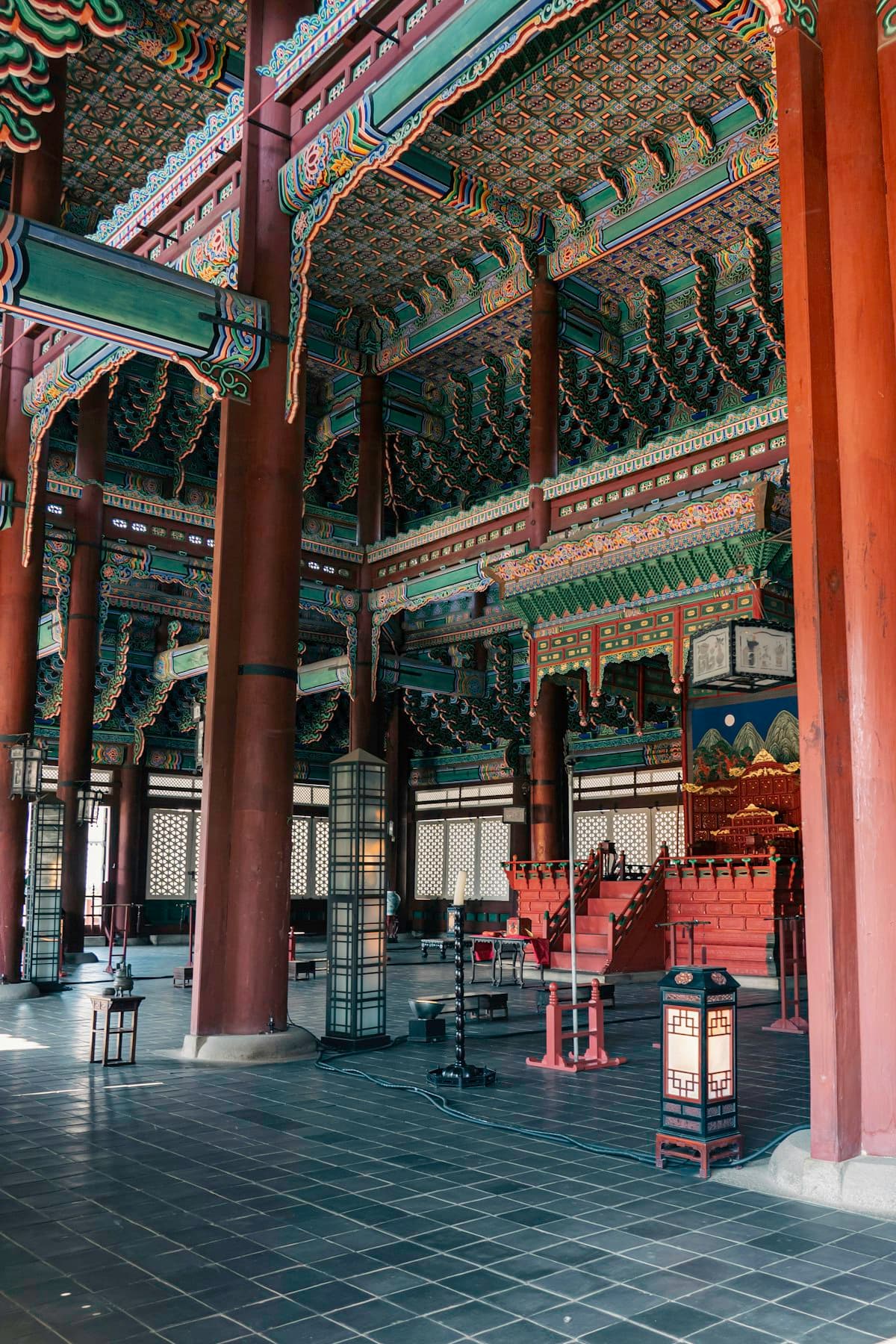 The ornate painted interior of a Korean royal palace hall