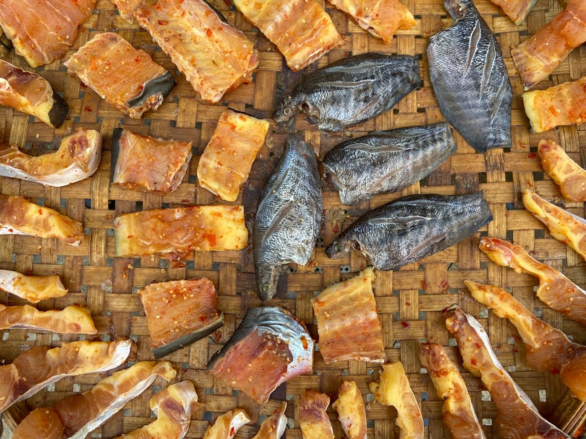 Dried fish and seafood laid out on a woven tray