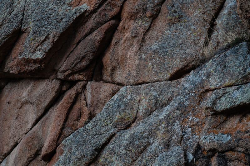 Close-up of a rough natural granite rock surface