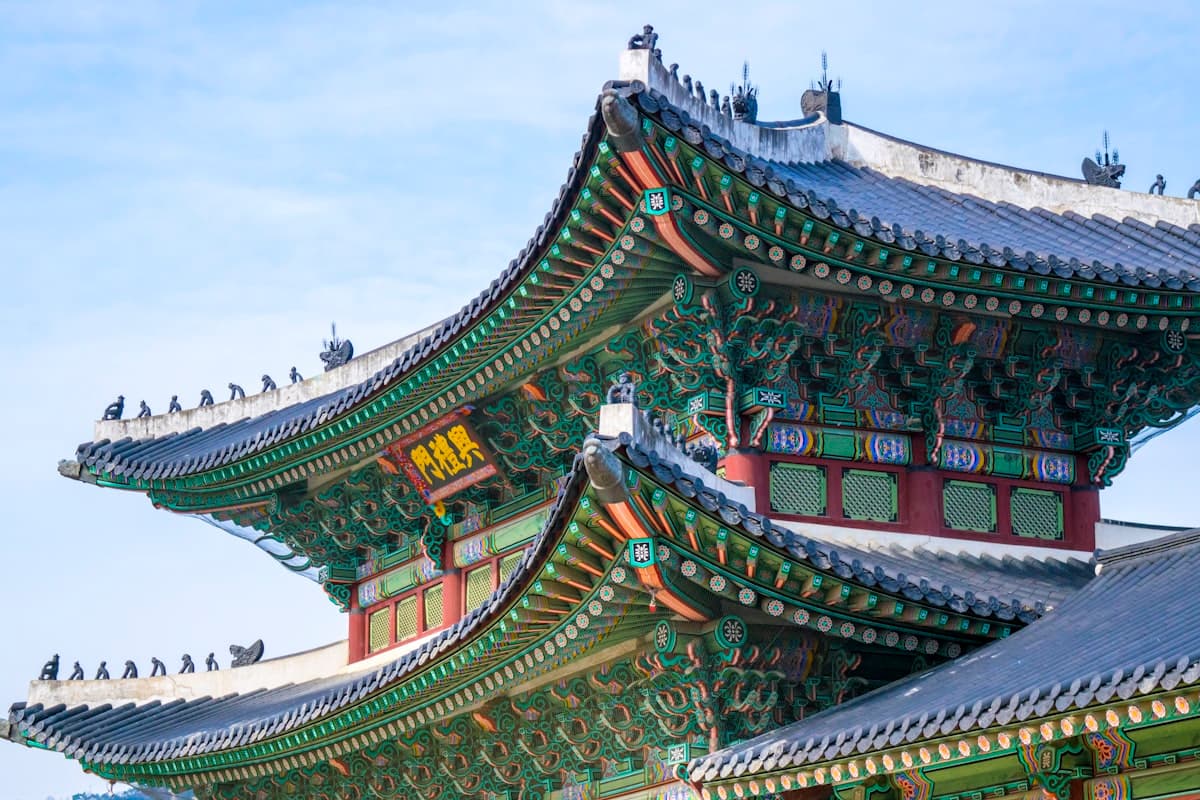 The ornate painted eaves of a traditional Korean temple roof