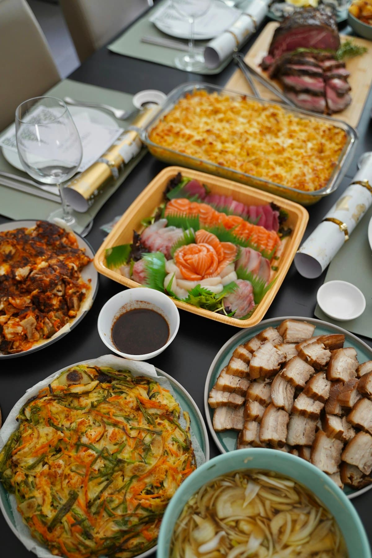 A Korean holiday table spread with multiple traditional dishes