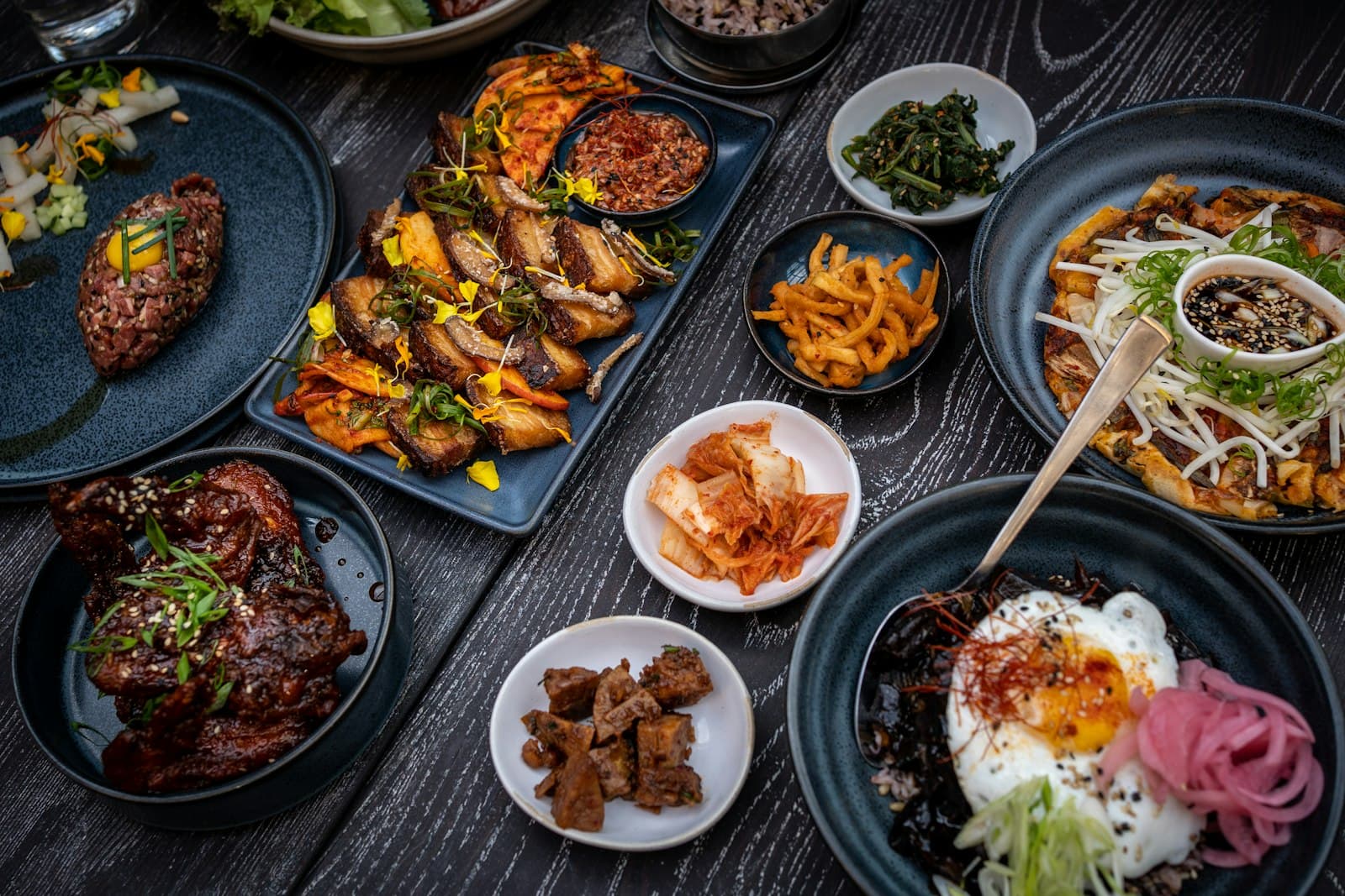 A spread of Korean dishes on a table