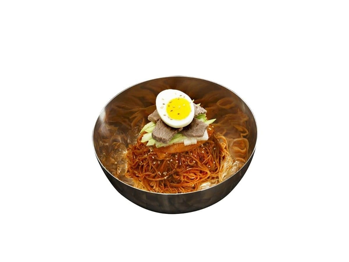 Chewy cold noodles in red sauce topped with egg, cucumber and pear