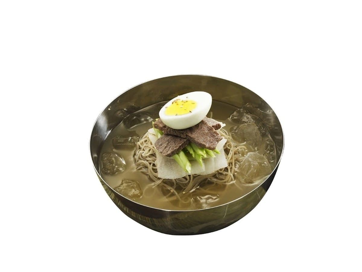 Chilled buckwheat noodles in icy broth with sliced beef, egg and radish