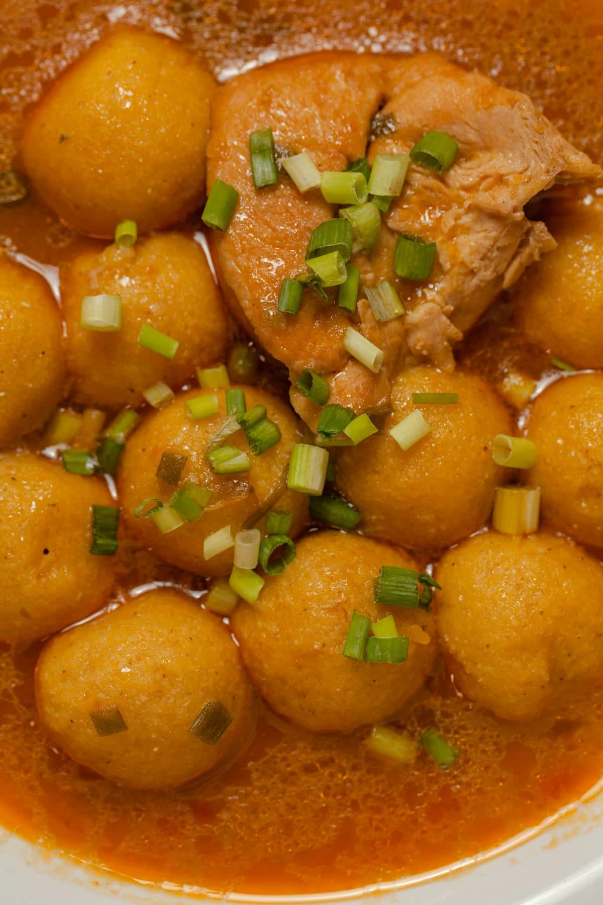 Bone-in chicken and potato chunks braised in thick red sauce