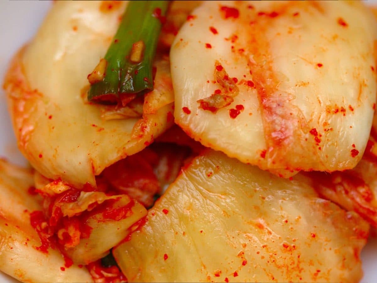 Salted napa cabbage leaves coated in chili paste