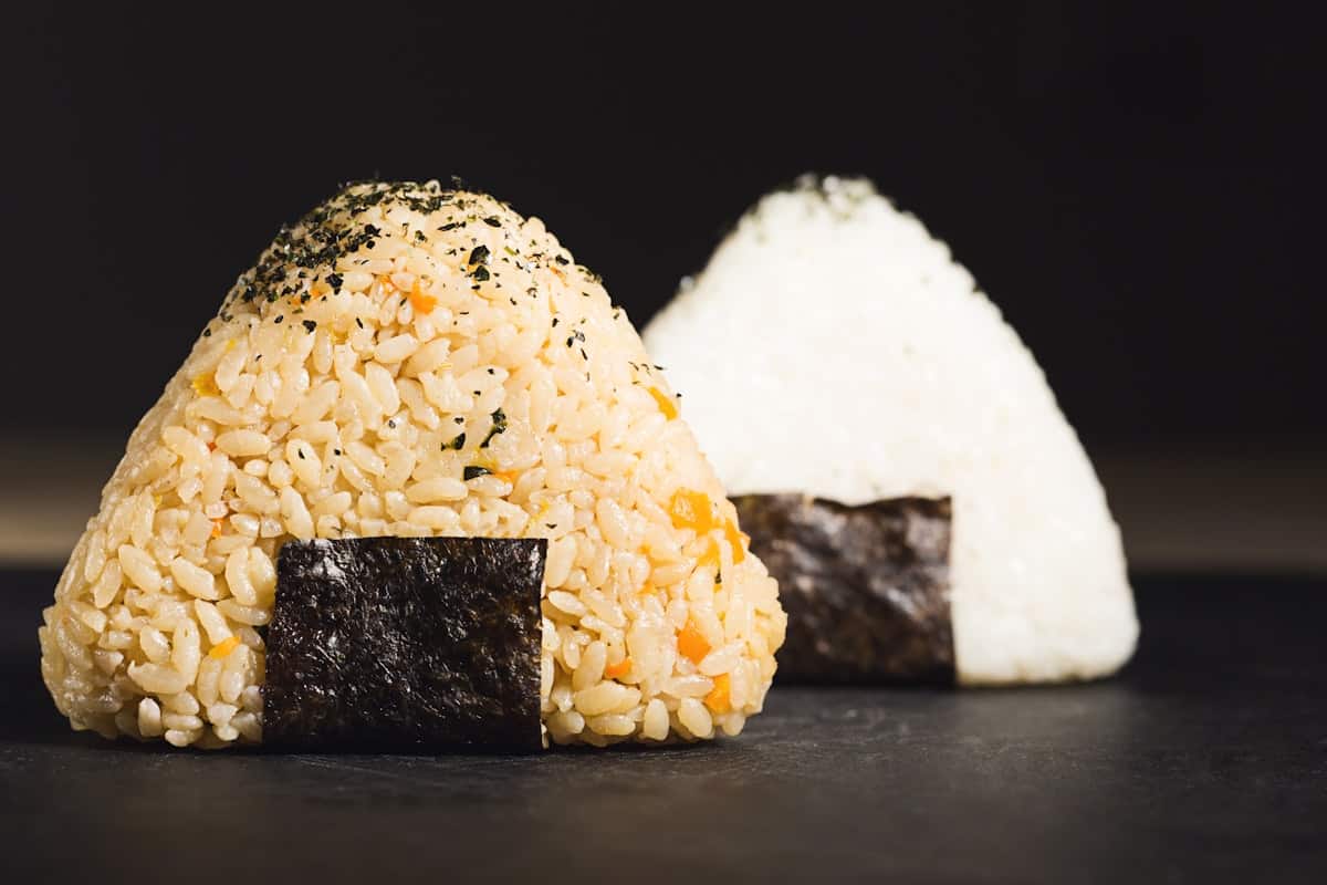 Triangle-shaped rice balls wrapped with a strip of seaweed