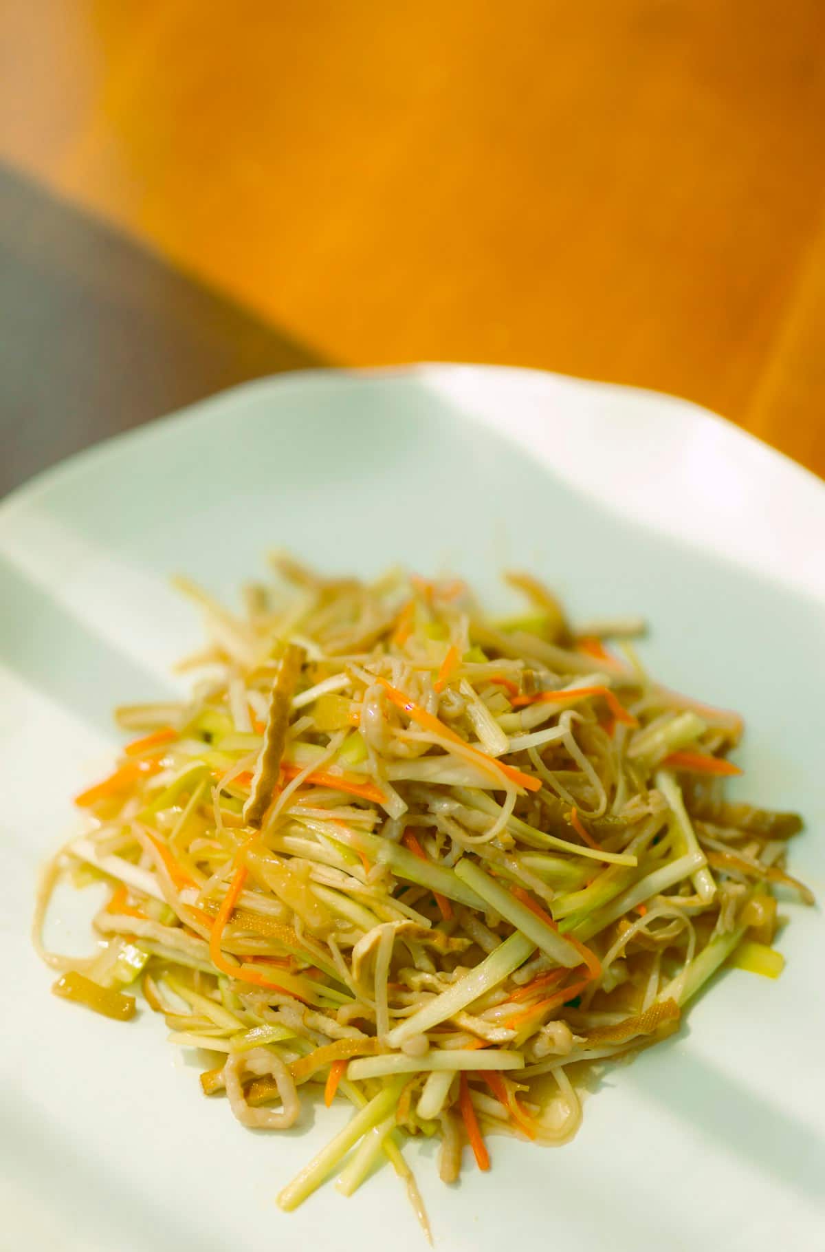 Seasoned shredded dried squid tossed with julienned vegetables