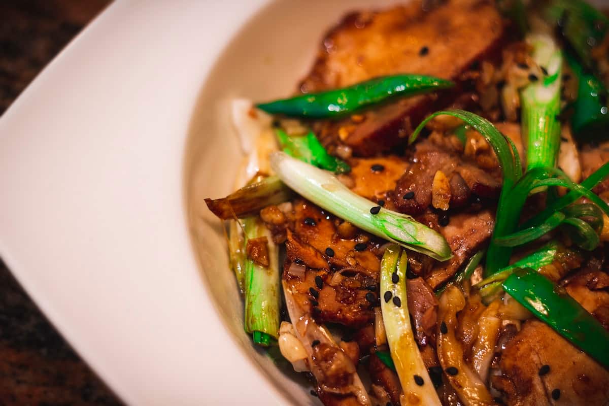 Fried chicken piled high with julienned green onion