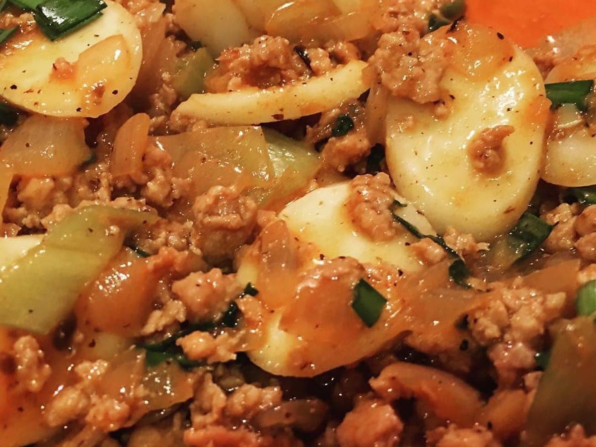 Skewered rice cakes coated in a glossy red sauce